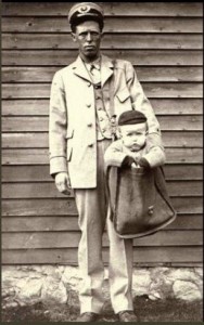 Letter carrier with child in mailbag